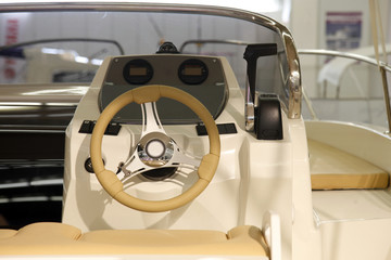 Instrument panel and steering wheel of a motor boat cockpit