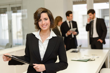 Business leader looking at camera in working environment