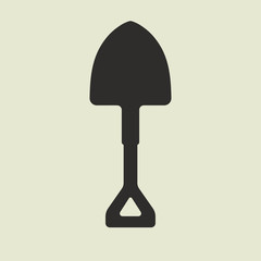Silhouette of cartoon shovel with yellow handle