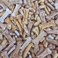 bone shaped pet food closeup, tasty background
