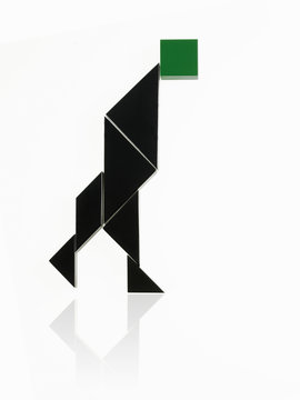 A number of triangles, squares and shapes arranged to represent a human being, in motion or action. 
