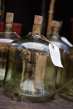Glass containers with labels on for overwintering and storage. 