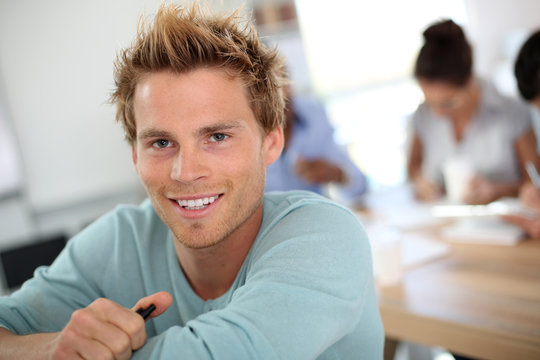 Closeup of young man in business class