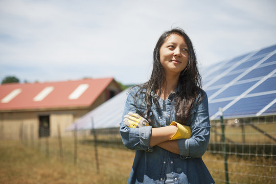Woman standing outdoors at farm