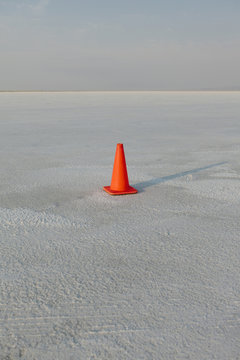Traffic cone on salt flats, during Speed Week