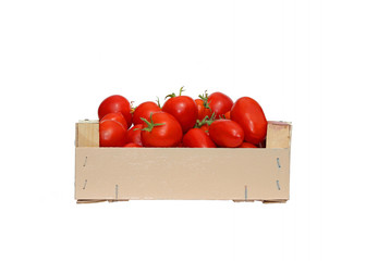 Red tomatoes in a wooden box isolated