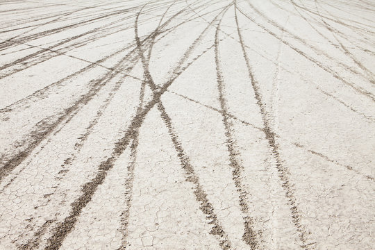 Tyre marks and tracks in the playa salt pan surface of Black Rock Desert, Nevada.