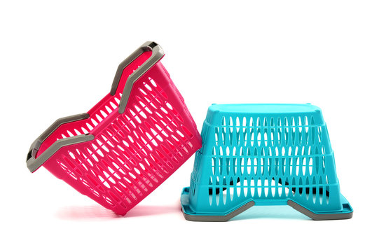  Blue and pink plastic shopping basket isolated on white. 