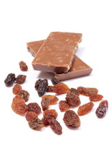 Raisins and portion of chocolate on white background