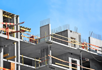 Building construction site work against blue sky