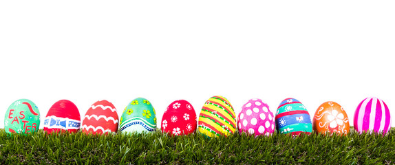 Easter Eggs on Fresh Green Grass over white background