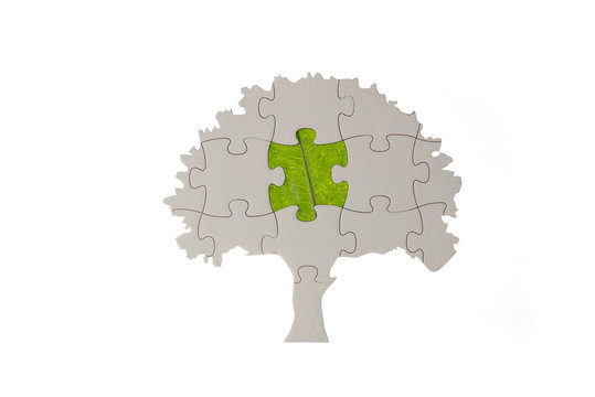 jigsaw puzzle tree with green leaf