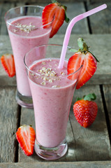 Strawberry smoothie on a wooden table