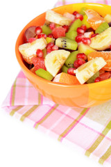 Sweet fresh fruits in bowl on table close-up