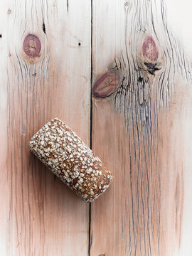 Organic Multi Grain Bread Loaf Cooling on Reclaimed Lumber Table Top