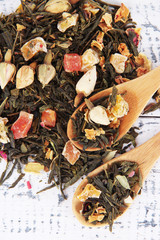 Aromatic dry tea on wooden background