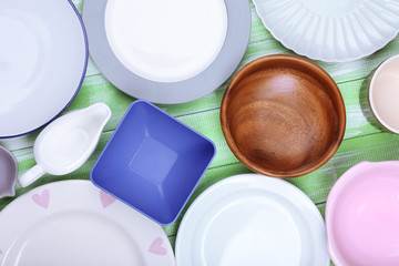 Different tableware on wooden background