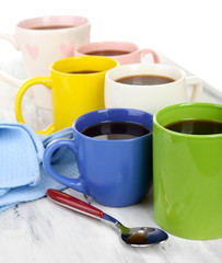 Many cups of coffee on wooden table close up
