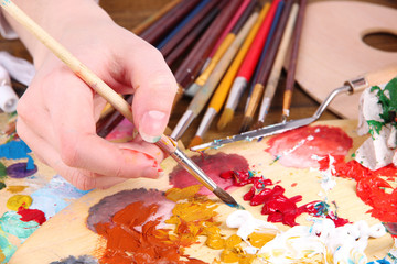Artist paints picture close-up