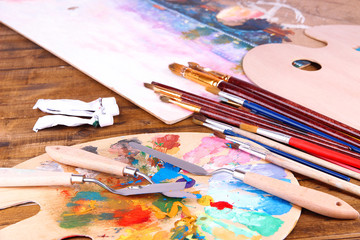 Fototapeta premium Artistic equipment: paint, brushes and art palette