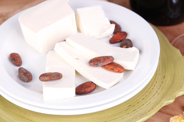 Assorted cheese plate on table background