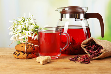 Tasty herbal tea and cookies on wooden table