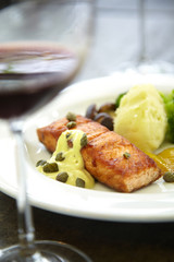 fish grill and red wine in natural light