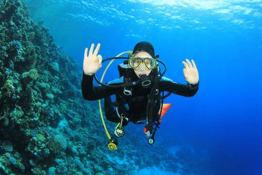 Young woman scuba diving having fun