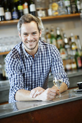 young bartender at his workplace