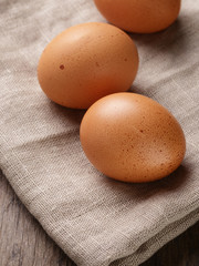 speckled chicken eggs on sack