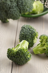 fresh broccoli on wood board