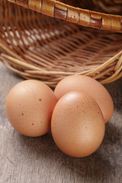 speckled chicken eggs on old table