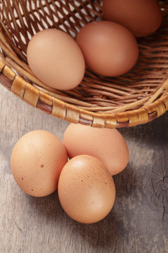 speckled chicken eggs on old table