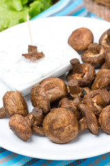 fried mushrooms with yogurt sauce, close-up