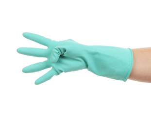 Hand shows four in rubber glove.