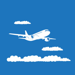 Obraz premium Airplane's silhouette with clouds on blue background.