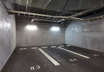 Parking garage underground interior, neon lights in dark