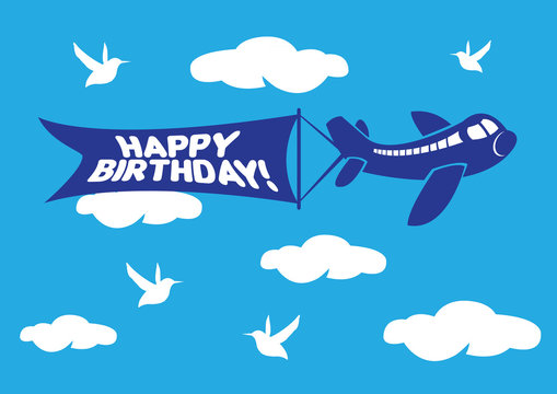 Aeroplane with birthday flying message banner.