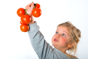 Fototapeta na wymiar child keeping up tomato