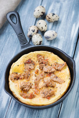 Quail eggs omelet with roasted pork, vertical shot