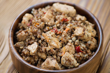 Close-up of stewed buckwheat with chicken fillet