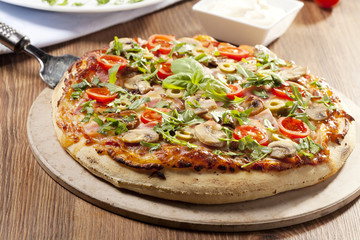 Pizza with ham and mushrooms