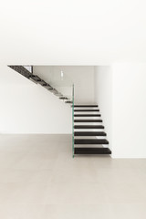 Interior, modern staircase in empty house.