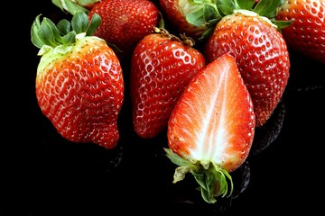 Fresh strawberries on a black background