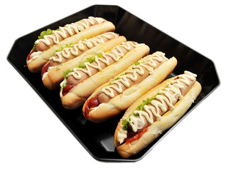 hot dog with mustard and tomato sauce Isolated on black backgrou