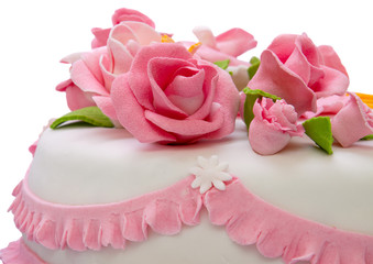 Festive marzipan cake decorated with pink roses.