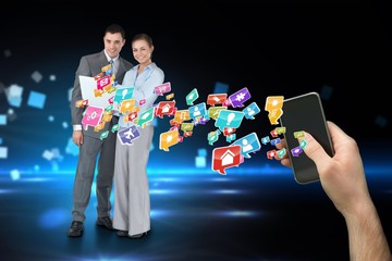 Hand holding smartphone with app icons and business partners