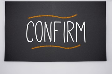 Confirm written on big blackboard