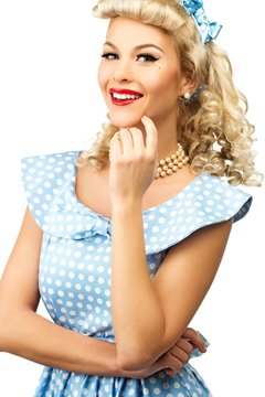 Sexy blond pin up style young woman in blue dress