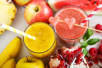 Fresh organic red and yellow smoothie with apple, watermelon, po